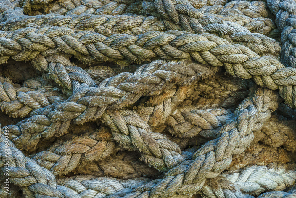 Twisted thick sea rope. Close-up view. Abstract background
