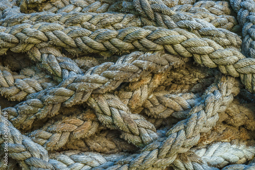 Twisted thick sea rope. Close-up view. Abstract background