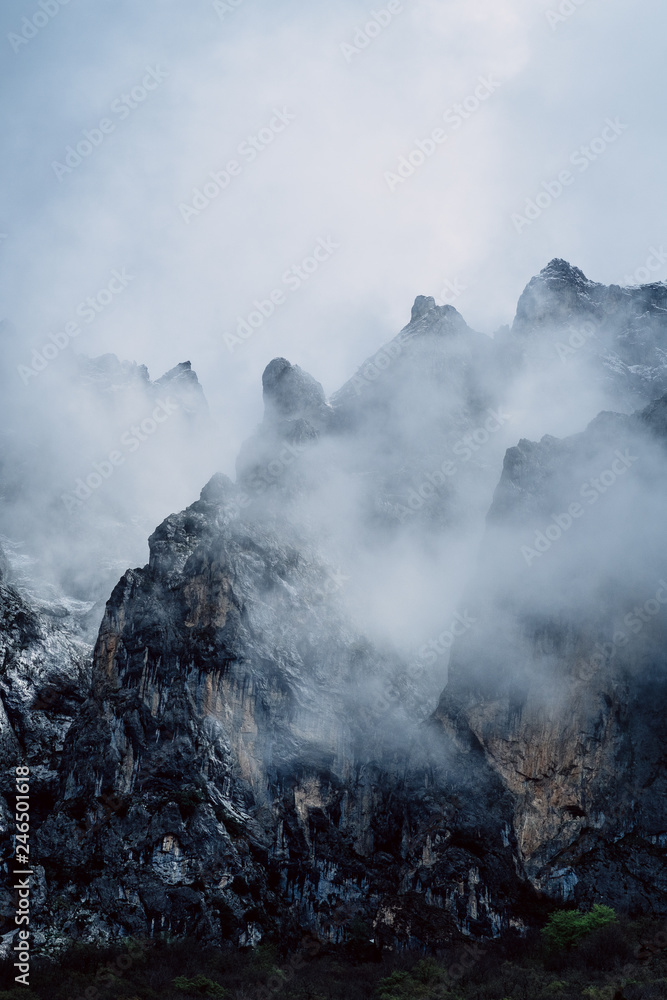 mountain peaks in fog