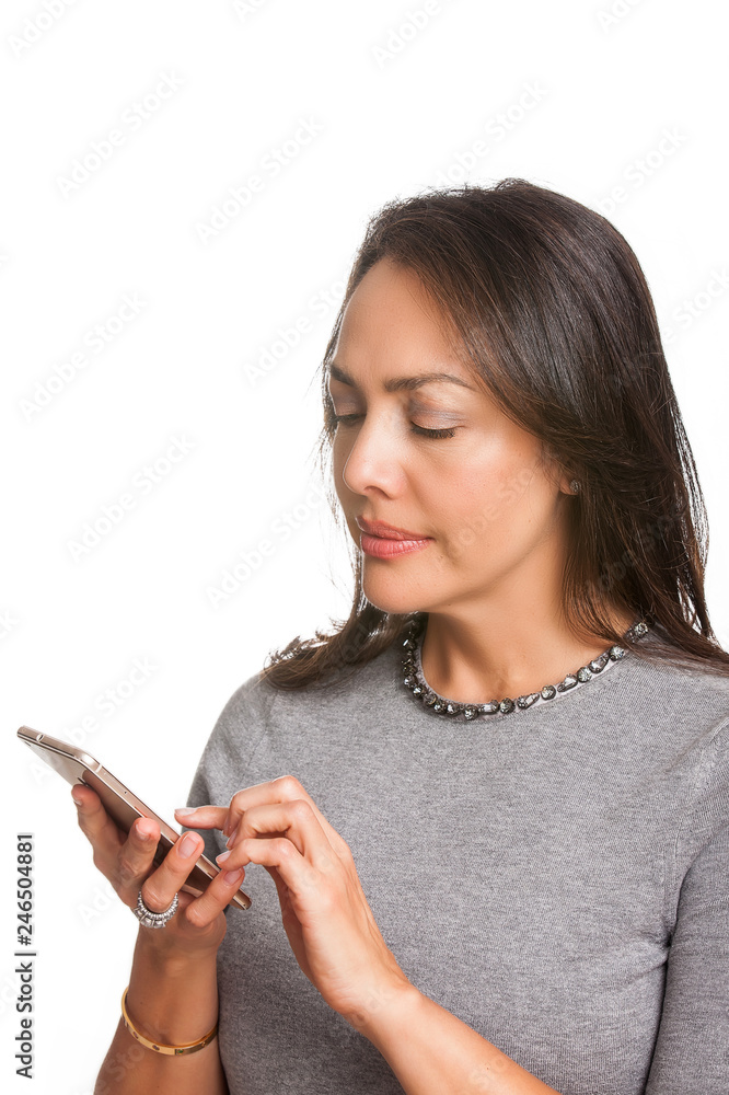 Young woman texting or surfing on her cellphone isolated on white background Young woman texting or surfing on her cellphone isolated on white background