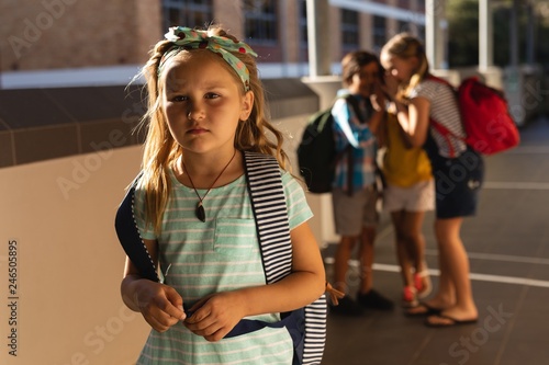 Εκτύπωση καμβά School friends bullying a sad girl in hallway of elementary