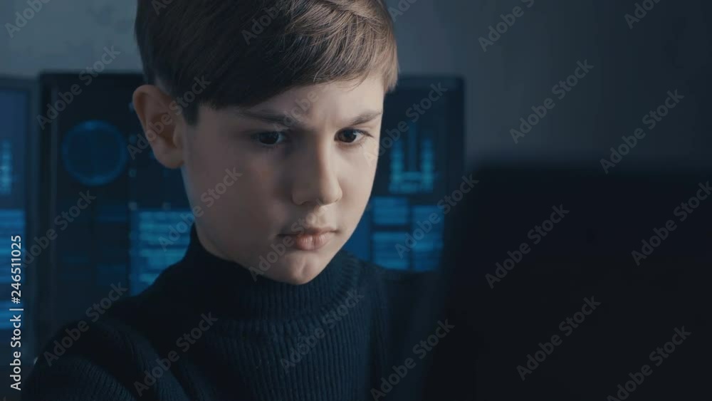 Cute child prodigy developing app. Cute kid young programmer working on computer at data center. Cute child prodigy developing app. Cute kid young programmer working on computer at data center.