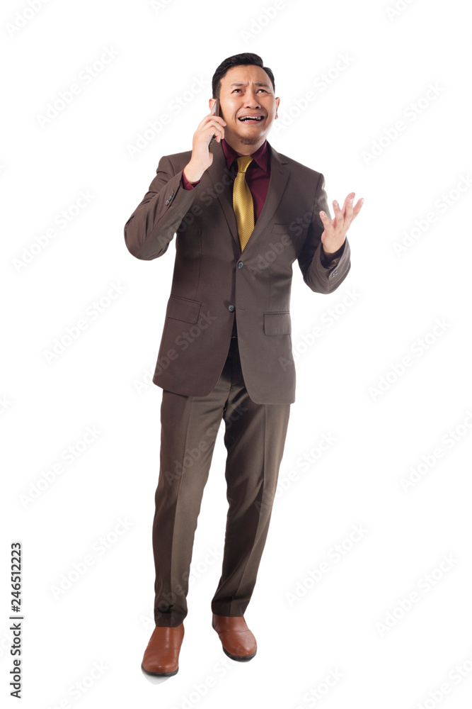 Young Man Talking on Phone, Angry Expression Young Man Talking on Phone, Angry Expression