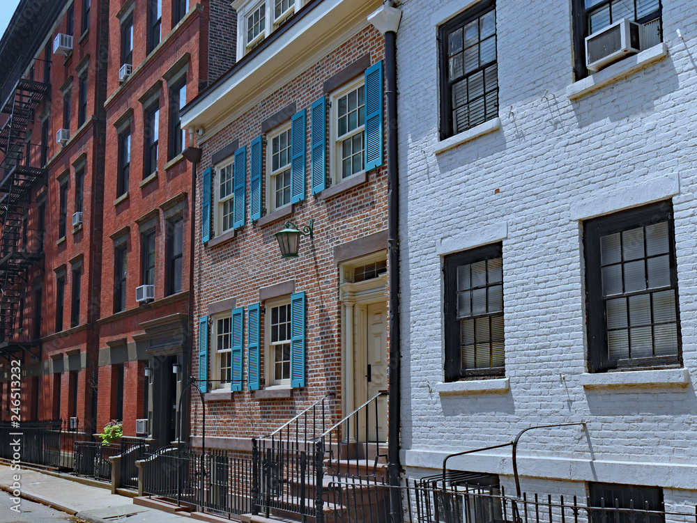 residential street in Greenwich Village, New York, with historic buildings from 1820s