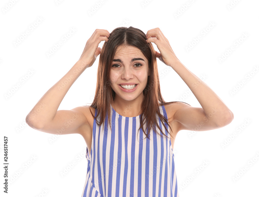 Young woman scratching head on white background. Annoying itch Young woman scratching head on white background. Annoying itch