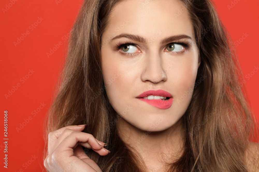 Young woman wearing beautiful lipstick on color background Young woman wearing beautiful lipstick on color background