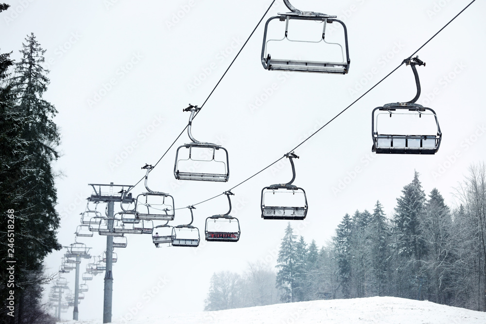 Ski lift at mountain resort. Winter vacation Ski lift at mountain resort. Winter vacation