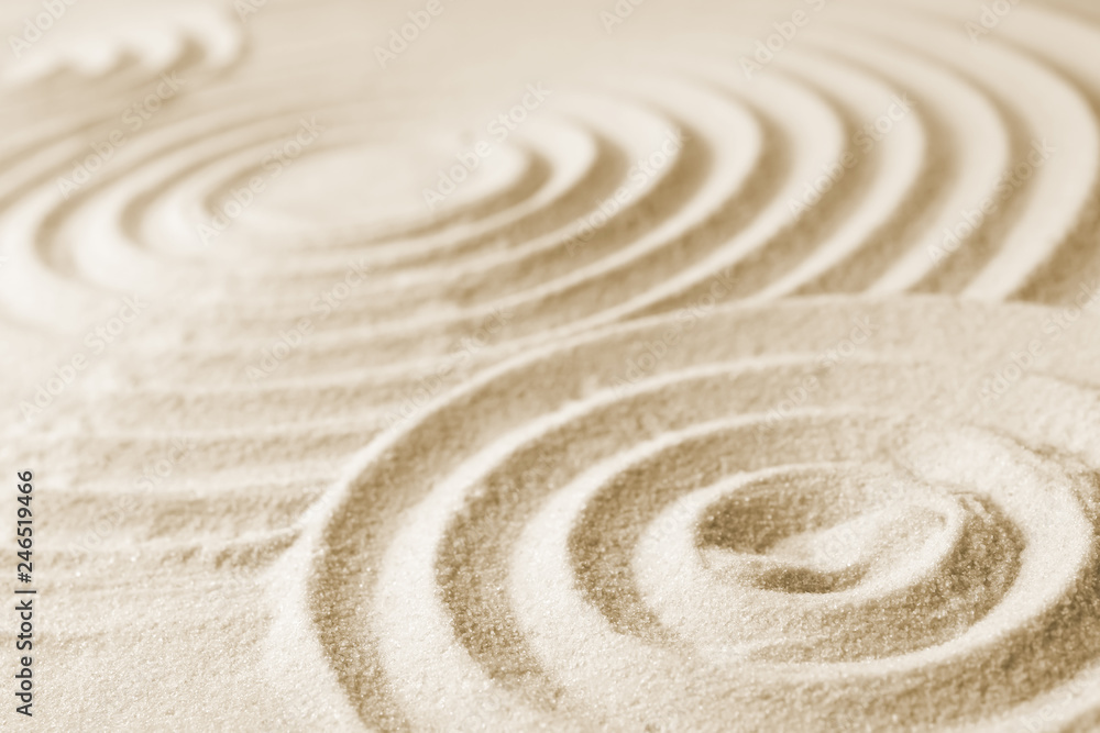 Fototapeta Zen garden pattern on sand. Meditation and harmony