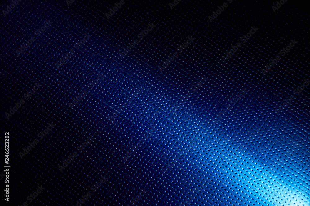 Diagonal bright beam of light on a blue background