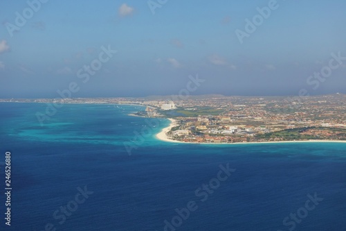 Aerial view of the Caribbean island of Aruba in approach to the Queen Beatrix International Airport (AUA) in Oranjestad © eqroy