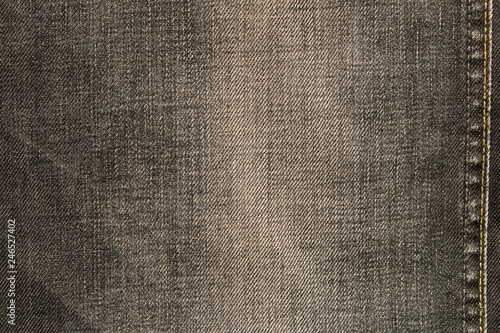 Texture of black jeans. Natural denim background. Close up.