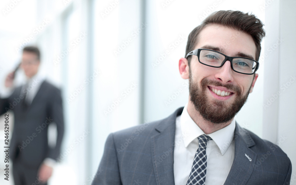 close up.businessman with glasses on the background of the office