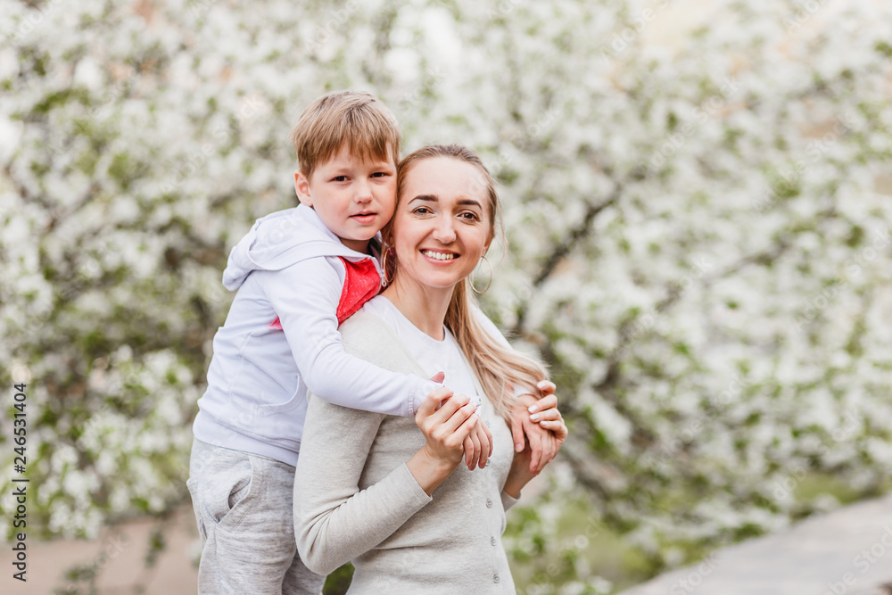 Fototapeta premium six-year-old boy hugging a young woman