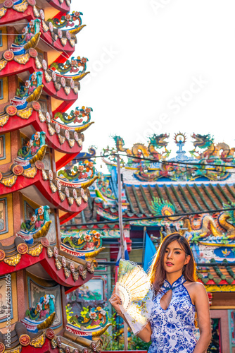 Portraits of a beautiful Chinese woman in the chines shrine is a public place for the people. © udom