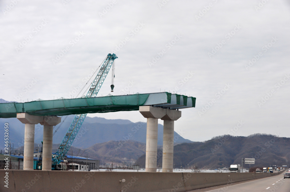 A bridge over the highway under construction
