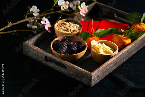 Group of colorful Vietnamese jam for Vietnam Tet holiday, also lunar new year of Asia, traditional preserved fruit from jujube, ginger jam and pumpkin seeds, tangerine