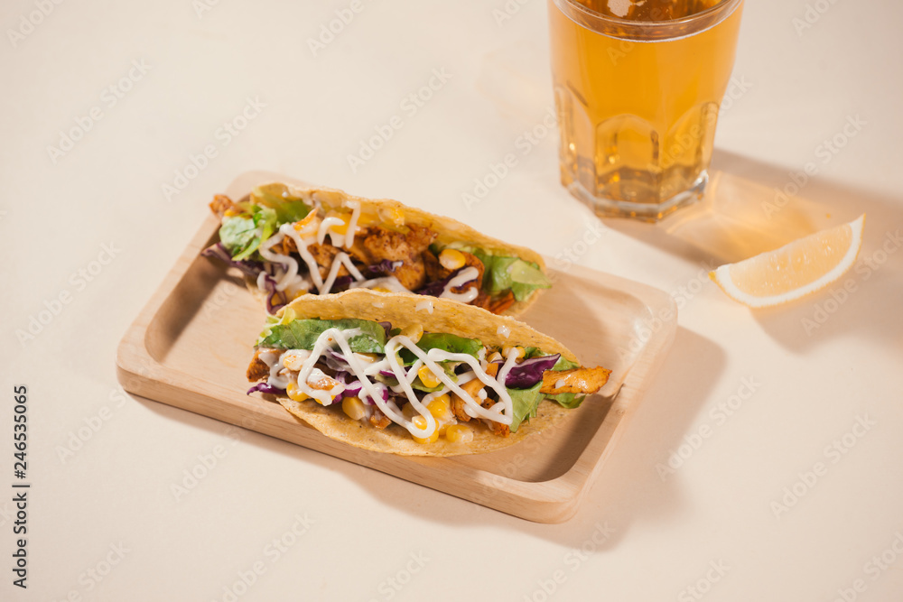 Traditional mexican taco with meat and vegetables. Latin american food. Traditional mexican taco with meat and vegetables. Latin american food.