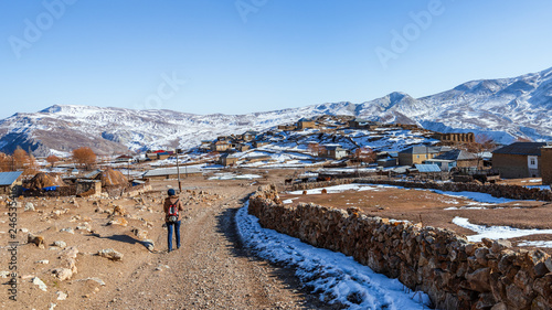 Tourist on a dirt road in Gryz village, Azerbaijan photo