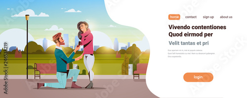 man kneeling holding engagement ring proposing woman marry him happy valentines day concept city park cityscape couple in love marriage offer copy space