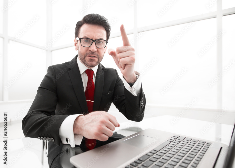 close up.confident businessman sitting at his Desk. close up.confident businessman sitting at his Desk.