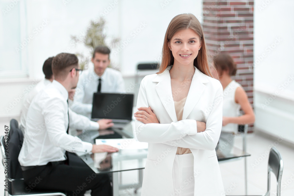 young employee standing in the office young employee standing in the office