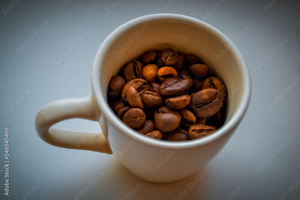 Cup with coffee grains Cup with coffee grains