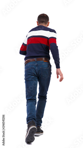 Back view of a running man in sweater.