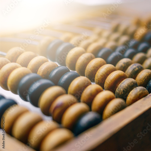 Close-up macro photo of vintage abacus for calculation.