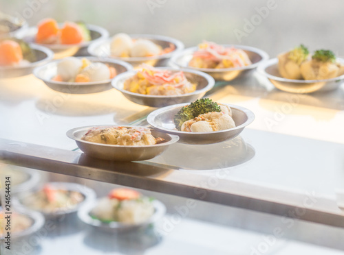 The background of food that is put in a wooden container (dim sum) containing vegetables, pork, flour Used to make, a menu that requires steaming stoves for good taste, delicious to eat 