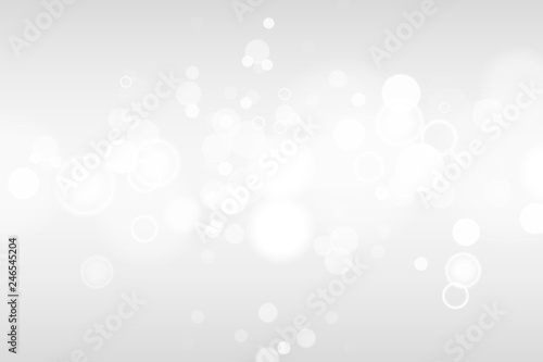 Silver and white bokeh lights defocused. Abstract background. Elegant, shiny, blurred light background. Magic christmas background. EPS 10.