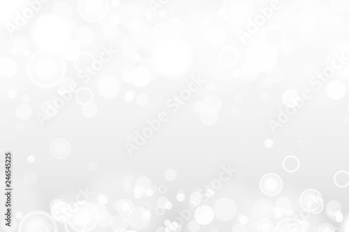 Silver and white bokeh lights defocused. Abstract background. Elegant, shiny, blurred light background. Magic christmas background. EPS 10.
