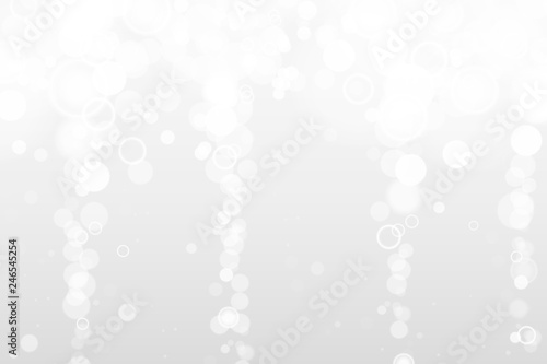 Silver and white bokeh lights defocused. Abstract background. Elegant, shiny, blurred light background. Magic christmas background. EPS 10. © volmon