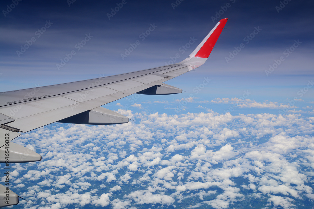 Aerial view Clouds and sky as seen through window of an aircraft Aerial view Clouds and sky as seen through window of an aircraft