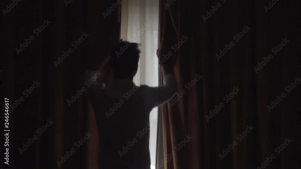 Man Open Big Window Curtains.Man In Dark Room Opens Curtains Slow Motion.Man Unveil Curtains And Admire Garden View From Window In Slow Motion.Man Looking At Window Slow Motion.Guy Stay Against Window Man Open Big Window Curtains.Man In Dark Room Opens Curtains Slow Motion.Man Unveil Curtains And Admire Garden View From Window In Slow Motion.Man Looking At Window Slow Motion.Guy Stay Against Window