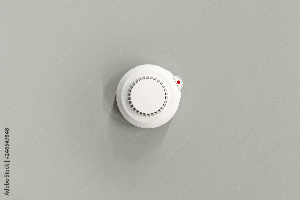 Smoke fire detected Smoke detector on gray. ceiling Smoke fire detected Smoke detector on gray. ceiling