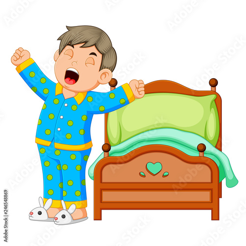 A boy wake up and stretching in morning 