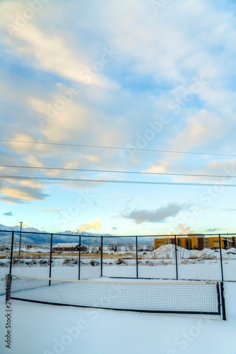 Cloudy sky over tennis court in Utah during winter