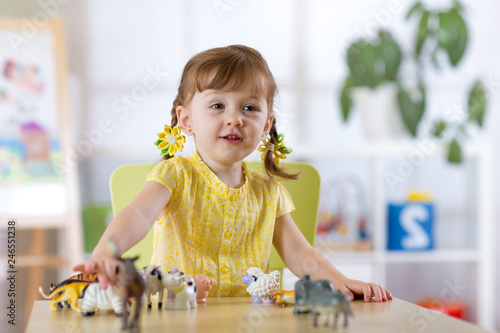 Portrait of joyful child gi...