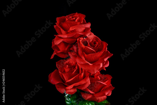 Bouquet of red roses on black background