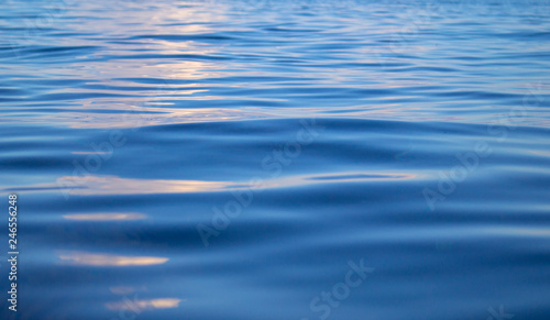Blue sea water with rippled surface. Still seawater texture. Breezy seaside landscape. Fresh clean water texture.