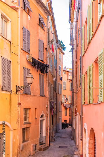 Nice, narrow street in the Vieux Nice, ancient buildings, typical facades in the old town, French Riviera