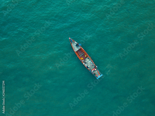 Vintage wooden boat in coral sea. Boat drone photo.