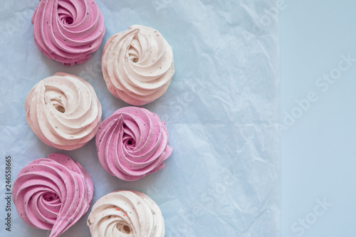 handmade marshmallows in pink and white are lying on the table in close-up. place for text, postcard