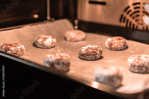 freshly baked chocolate cookies sprinkled with powdered sugar close-up