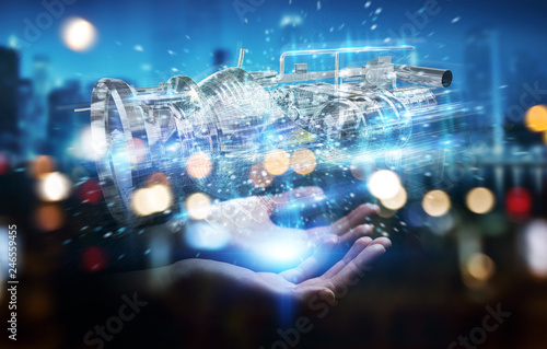 Businesswoman using wireframe holographic 3D digital projection of an engine © sdecoret