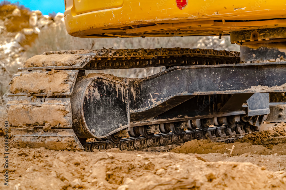 Excavator with caked dirt on its track pad in Utah Excavator with caked dirt on its track pad in Utah