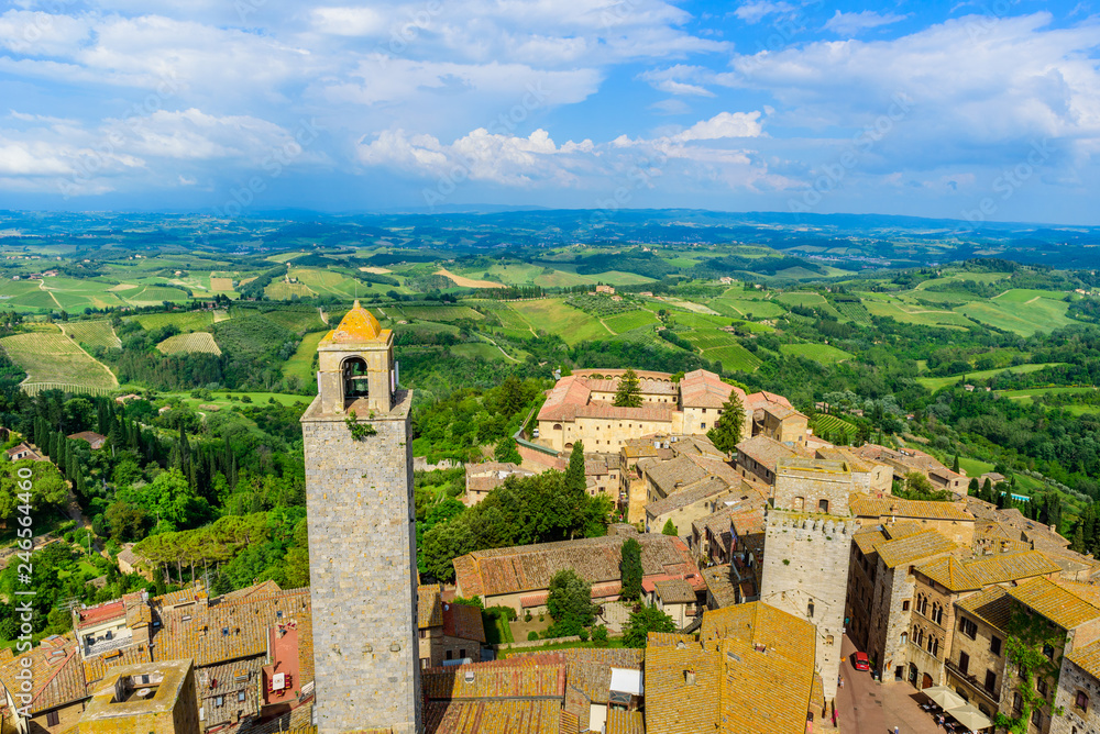San Gimignano - Aerial view of the historic town with beautiful landscape scenery on a sunny summer day in Tuscany, small walled medieval hill town with towers in the province of Siena, Italy