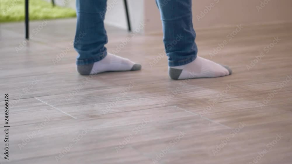 Young Woman with Broom, Cleaning Floor at Home. Female Sweeps Dust in room and brings Order and Cleanliness in House. Housewife sweeping Floor using Brush. Housework and Housekeeping concept. Young Woman with Broom, Cleaning Floor at Home. Female Sweeps Dust in room and brings Order and Cleanliness in House. Housewife sweeping Floor using Brush. Housework and Housekeeping concept.