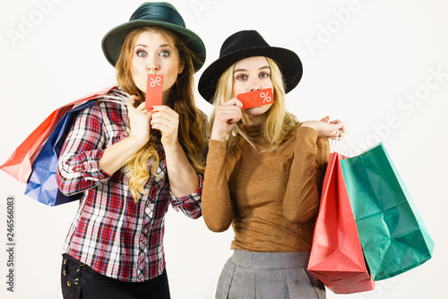Two woman after sale shopping
