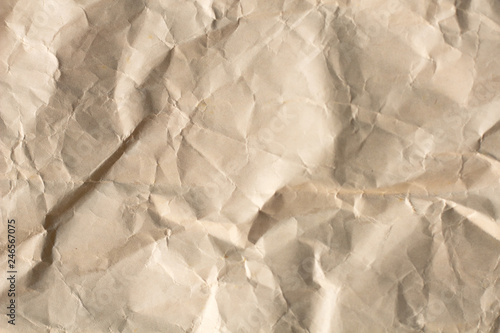 Light brown crumpled paper texture for background.backdrop for art work design or add text message.